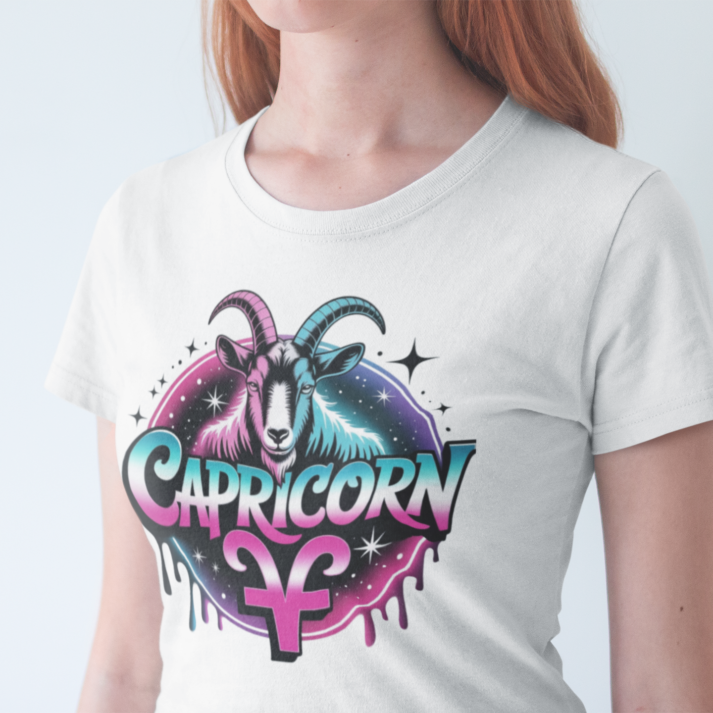 Person wearing a white t-shirt with Capricorn zodiac design