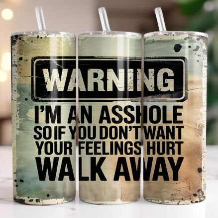 Three tumblers with a humorous warning message on a blurred background
