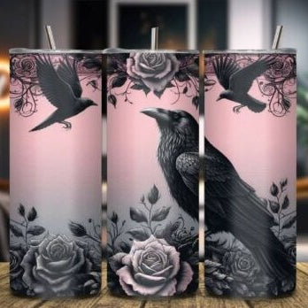 Three cylindrical candles with crow and rose designs on a wooden surface.