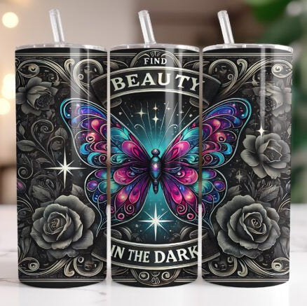 Three tumblers with a butterfly design and motivational quote on a blurred background