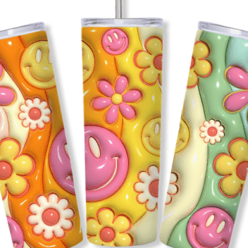 Three colorful tumblers with floral and smiley face designs on a wooden surface.