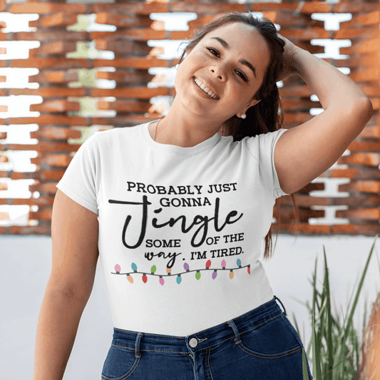 Woman wearing a t-shirt with a humorous text design outdoors.