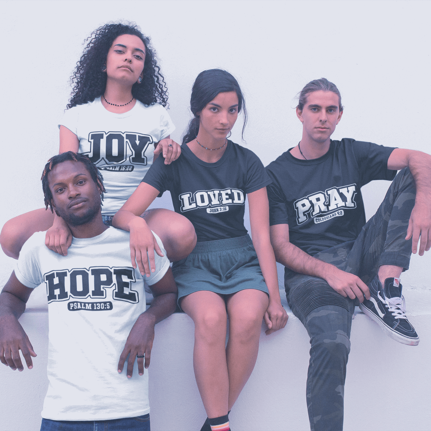 Four people wearing t-shirts with motivational phrases on a white background