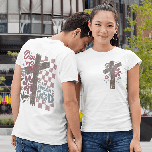 Two people wearing white t-shirts with graphic designs outdoors.