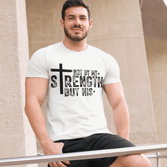 Man wearing a white t-shirt with a black text design, sitting on a metal railing.
