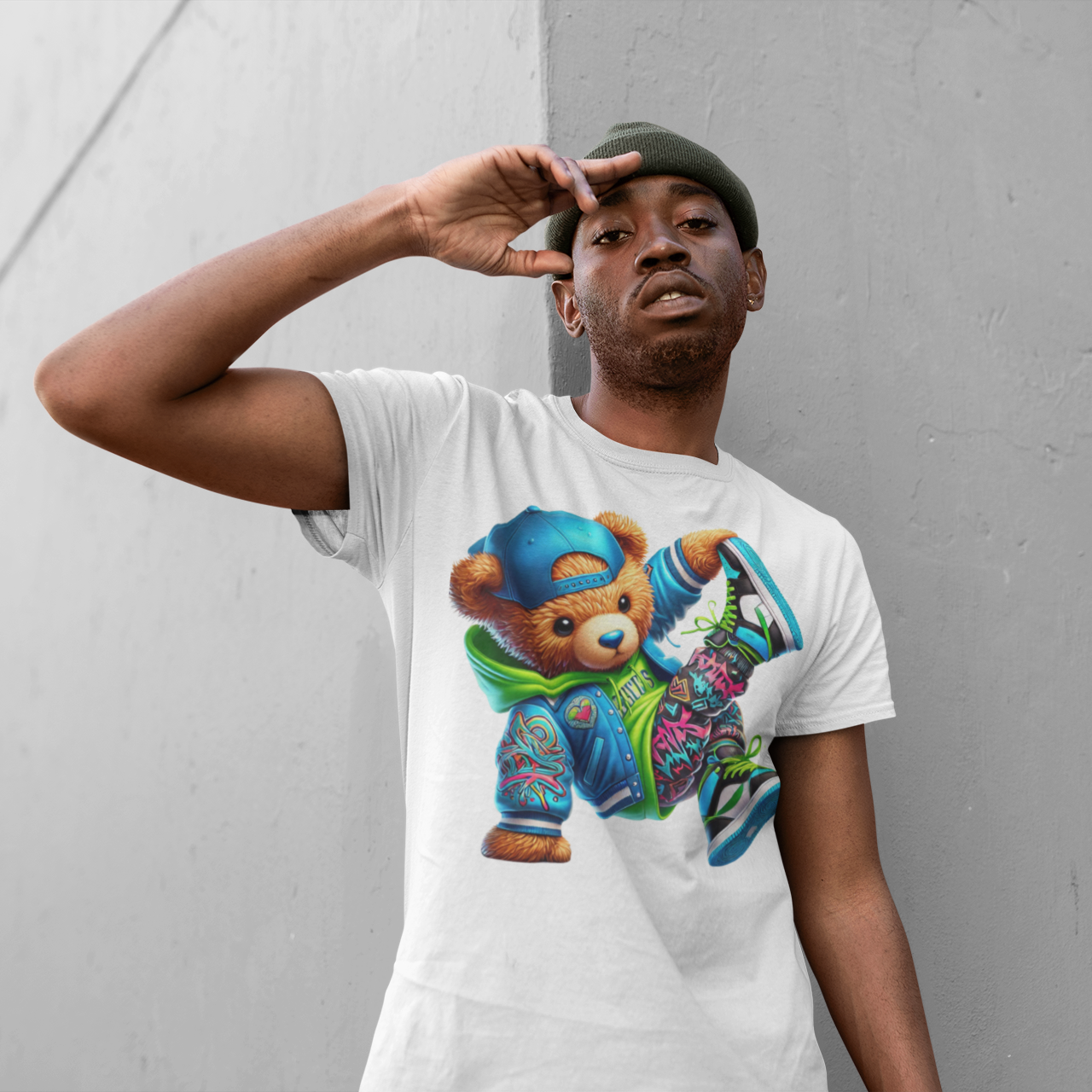 Person wearing a white t-shirt with a colorful bear graphic against a gray background