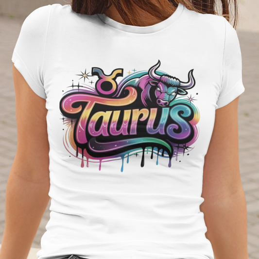 White t-shirt with colorful Taurus graphic design on a neutral background