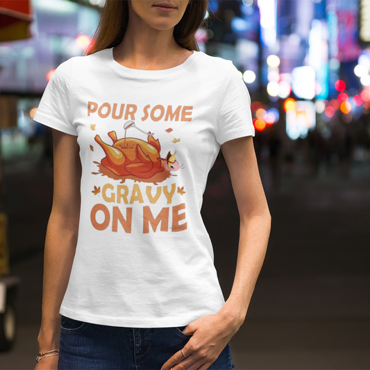 Person wearing a white t-shirt with a humorous Thanksgiving design in an urban setting.