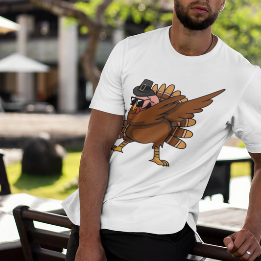 Man wearing a white t-shirt with a cartoon turkey design outdoors.
