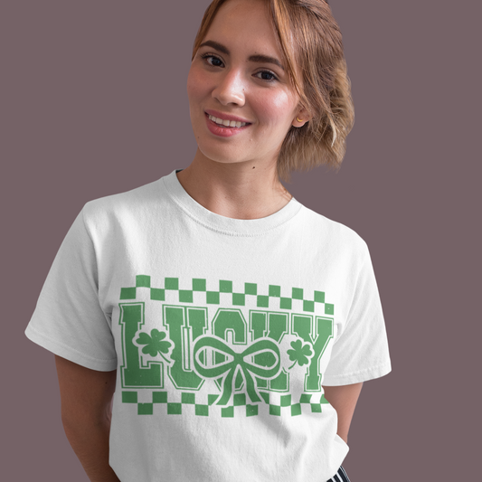 Woman wearing a white t-shirt with green text and design on a plain background