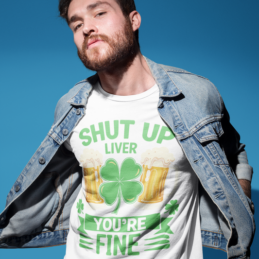 Man wearing a white t-shirt with green text and graphics against a blue sky