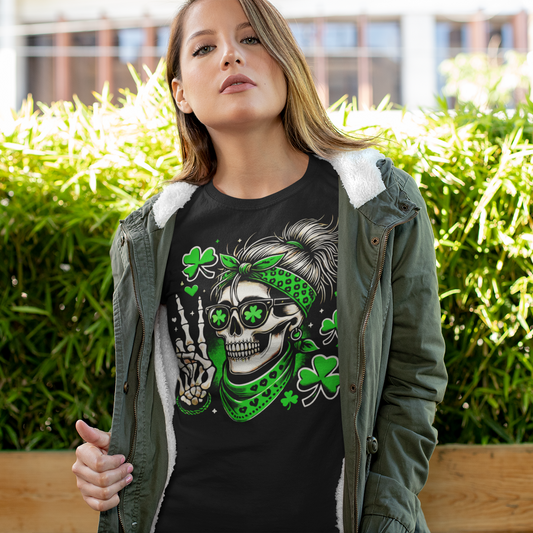 Person wearing a black t-shirt with a skull and shamrock design outdoors.