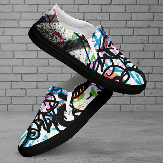 Colorful graffiti-style slip-on shoes on a white background